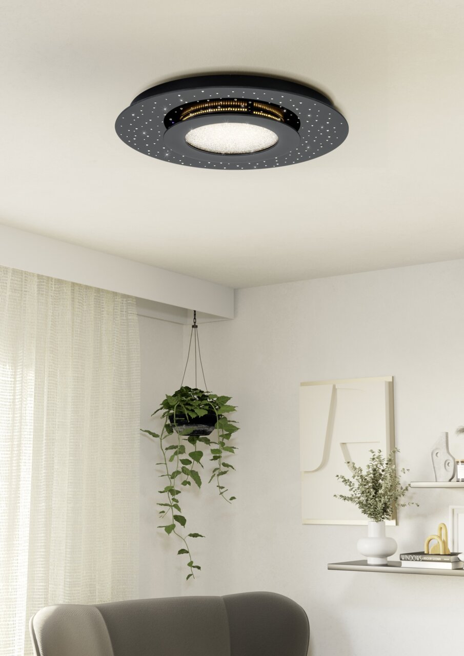 Moderne LED-Deckenleuchte in schwarzem Design mit funkelnden Details, von unten betrachtet in einem stilvoll eingerichteten Raum.