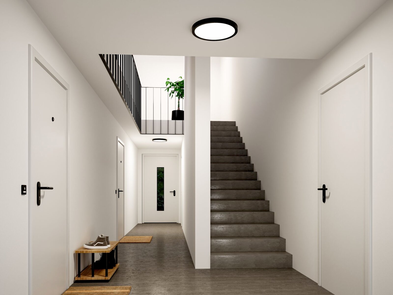 Moderne runde LED-Deckenleuchte mit schwarzem Rahmen in einem hellen Flur mit Treppe, Ansicht von unten nach oben (Untersicht)