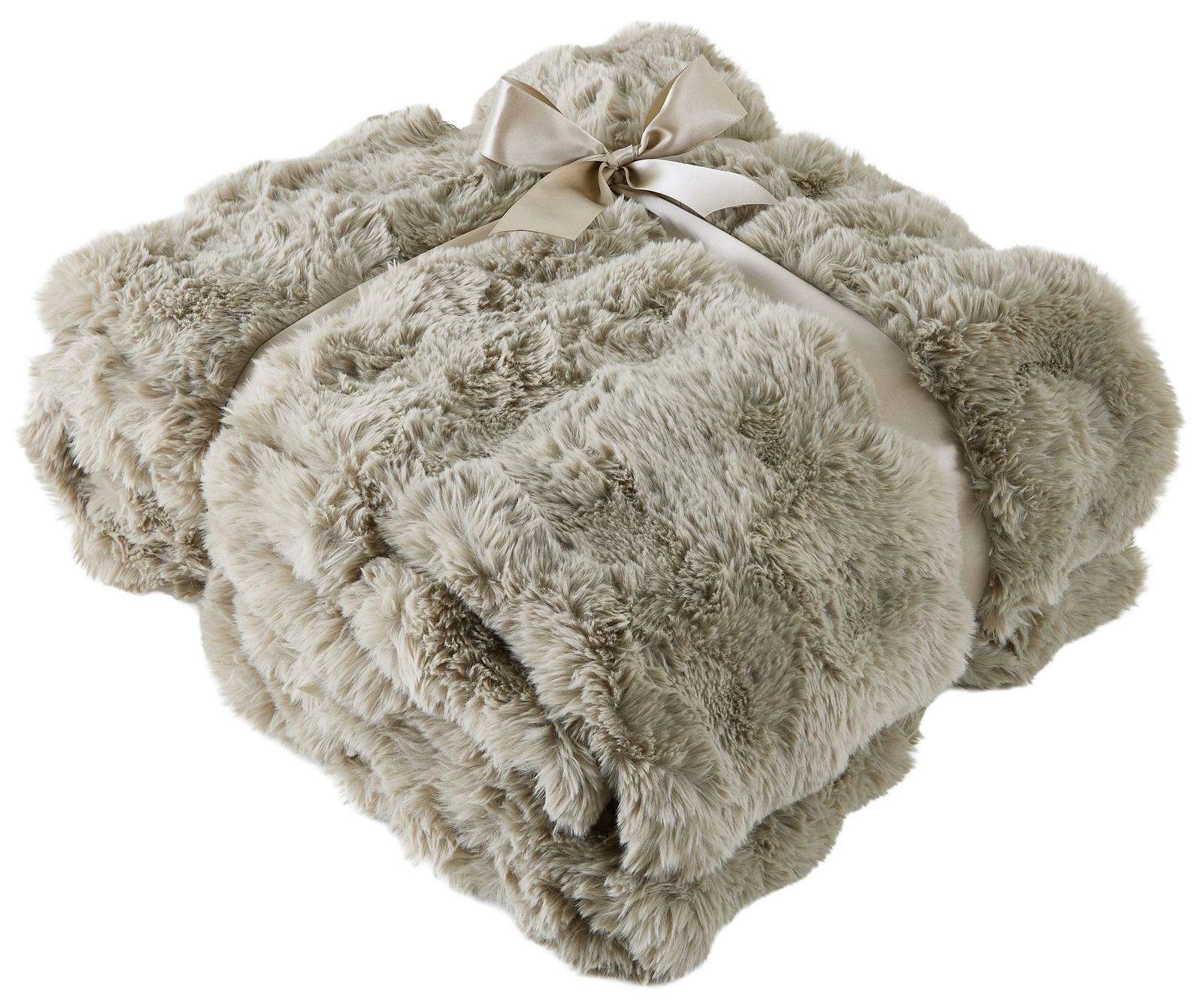 Linneweber Felldecke POMPON 150x200cm Weiche, beige Felldecke 150x200cm, zusammengefaltet und mit einer Schleife gebunden, aus der Vogelperspektive.