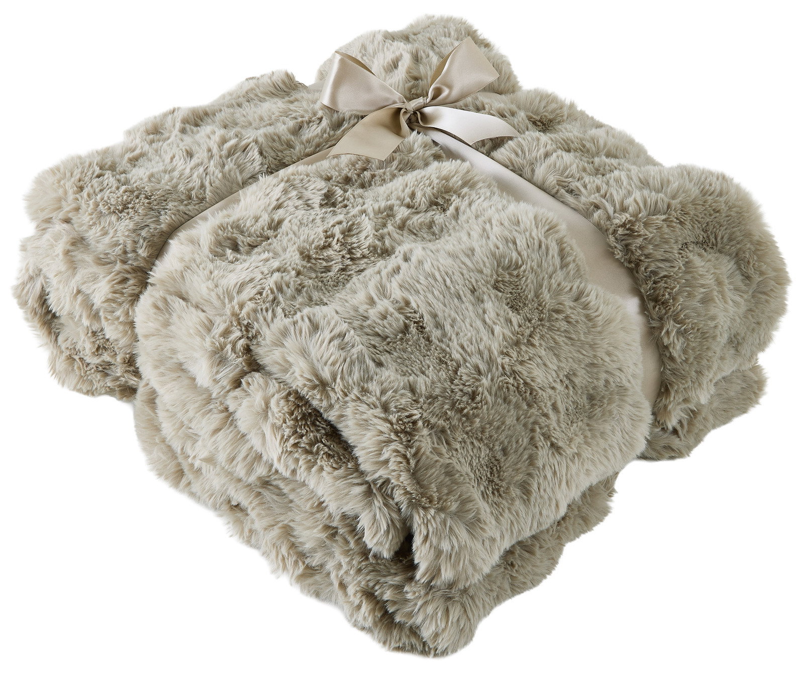 Linneweber Felldecke POMPON 150x200cm Weiche, beige Felldecke 150x200cm, zusammengefaltet und mit einer Schleife gebunden, aus der Vogelperspektive.