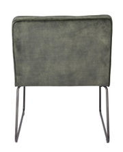 Rückansicht eines Loungesessels mit grünem Stoffbezug und schwarzen Metallbeinen.