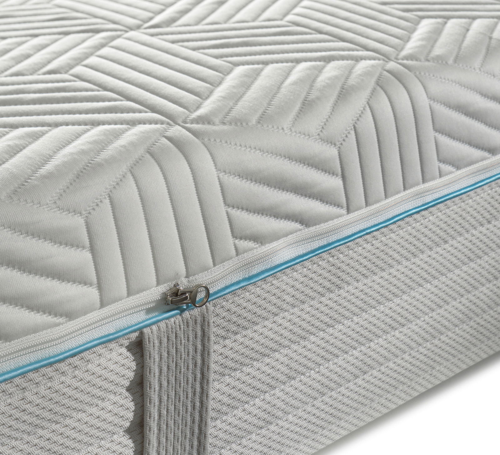 Dieter Knoll Gel-Taschenfederkernmat. H2 OPTIFLOW GEL TFK 24 Nahaufnahme einer Gel-Taschenfederkernmatratze mit geometrischem Muster und Reißverschluss an der Seite.