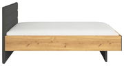 Seitliche Ansicht eines modernen Jugendbetts mit Holzoptik und gepolstertem Kopfteil in Dunkelgrau.