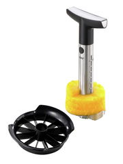 Ananasschneider Professional aus Edelstahl mit ergonomischem Griff und schwarzem Kunststoff-Schneider, seitliche Perspektive.