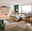 Modernes Schlafzimmer mit Holzmöbeln, großem Fenster, Bergblick, Teppichen und grünen Akzenten.
