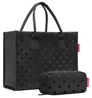 Schwarze Einkaufstasche und Etui mit Punktmuster, seitliche Perspektive