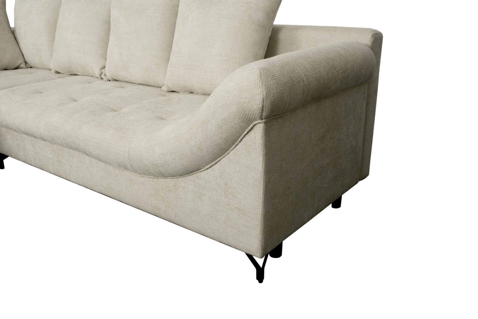 Nahaufnahme einer beigen Sofaecke mit Ottomane links, seitliche Perspektive.