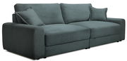 Großes, modernes Big-Sofa in grauer Cordoptik mit zwei passenden Kissen, seitliche Perspektive