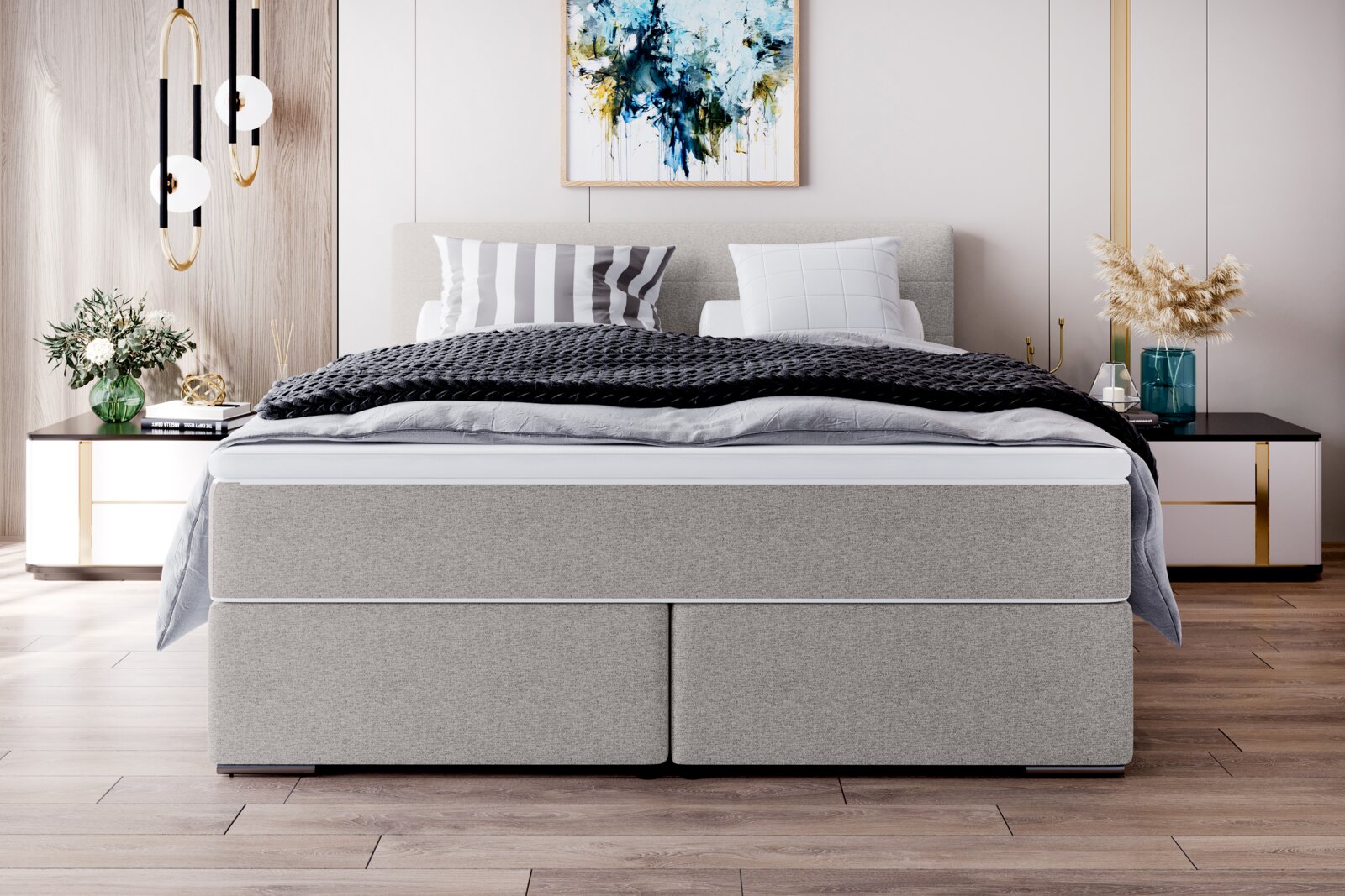 Modernes graues Boxspringbett mit gepolstertem Kopfteil und schwarzer Strickdecke im stilvollen Schlafzimmer, Frontansicht auf Augenhöhe.