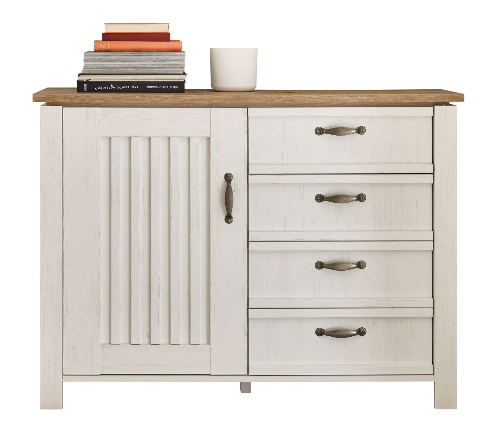 Weiße Kommode mit drei Schubladen und einer Tür, darauf Bücher und eine Tasse, Frontalansicht