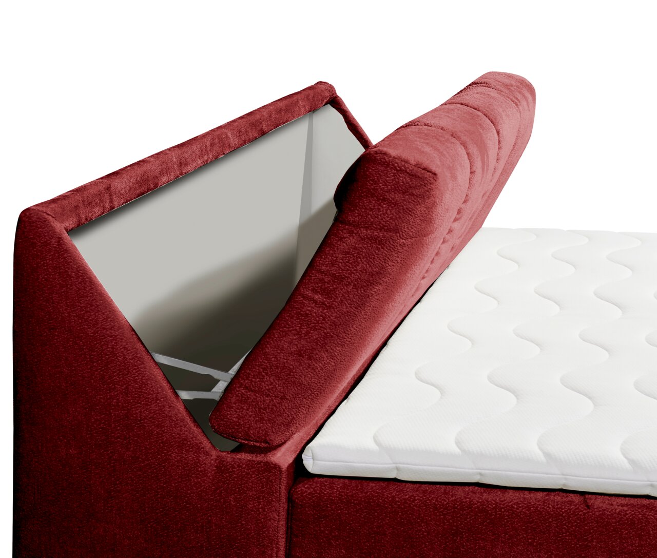 Nahaufnahme eines Boxspringbetts mit rotem Stoffbezug und geöffneter Stauraumfunktion, seitliche Perspektive