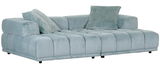 Großes, modernes Big-Sofa in hellblauem Stoff mit zwei passenden Kissen, seitliche Perspektive.