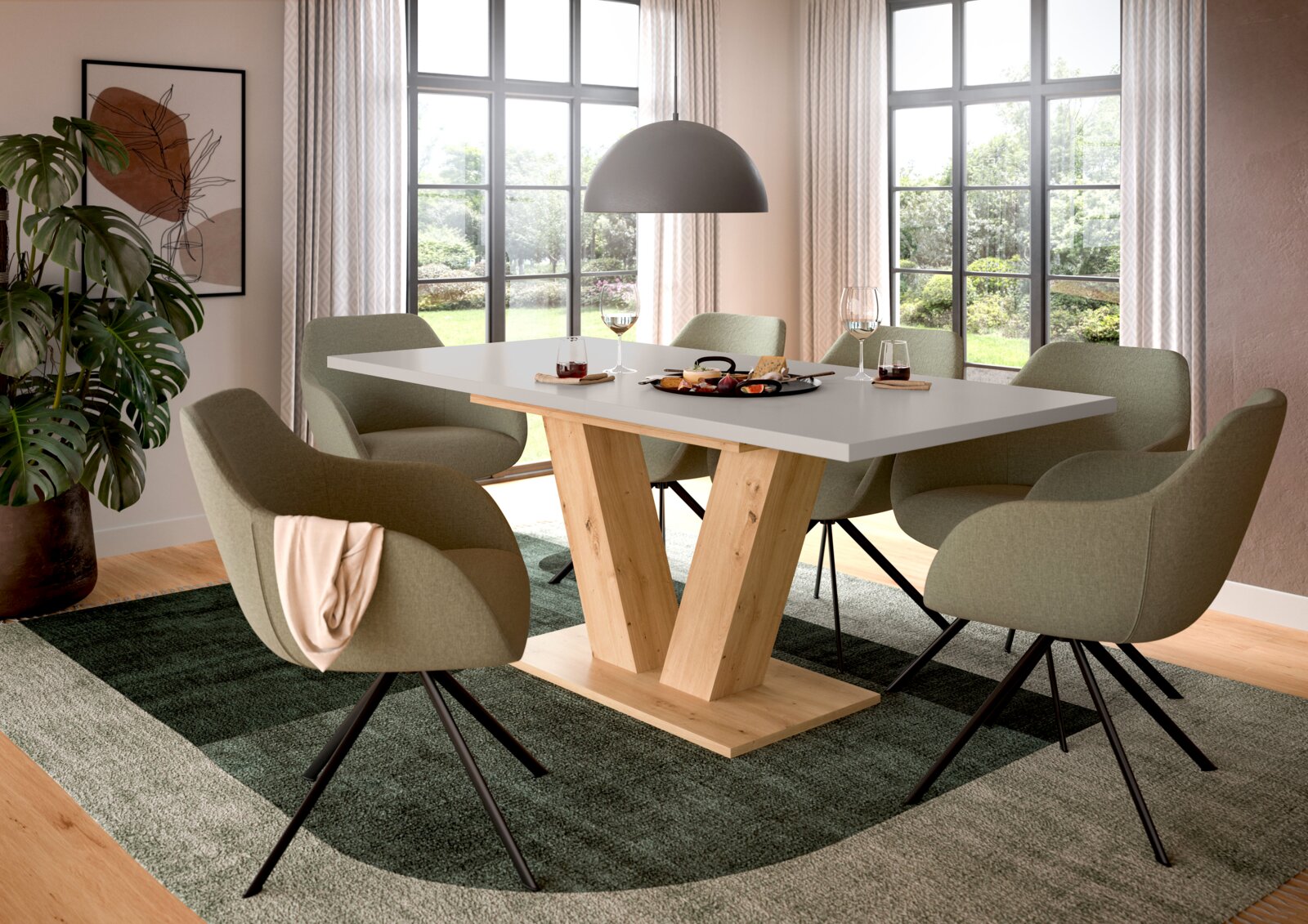 MID.YOU Esstisch MOTION Moderner Esstisch mit weißer Tischplatte und V-förmigem Holzgestell, umgeben von sechs olivgrünen Polsterstühlen in einem hellen Esszimmer; Perspektive: leicht seitliche Frontansicht auf Tisch und Sitzgruppe