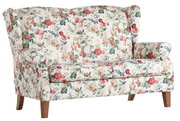 Zweisitzige Sofabank mit floralem Muster, seitliche Perspektive