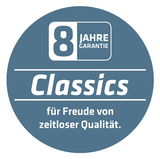 Rundes Emblem mit der Aufschrift '8 Jahre Garantie' und 'Classics für Freude von zeitloser Qualität' in blauer Farbe, frontal betrachtet.