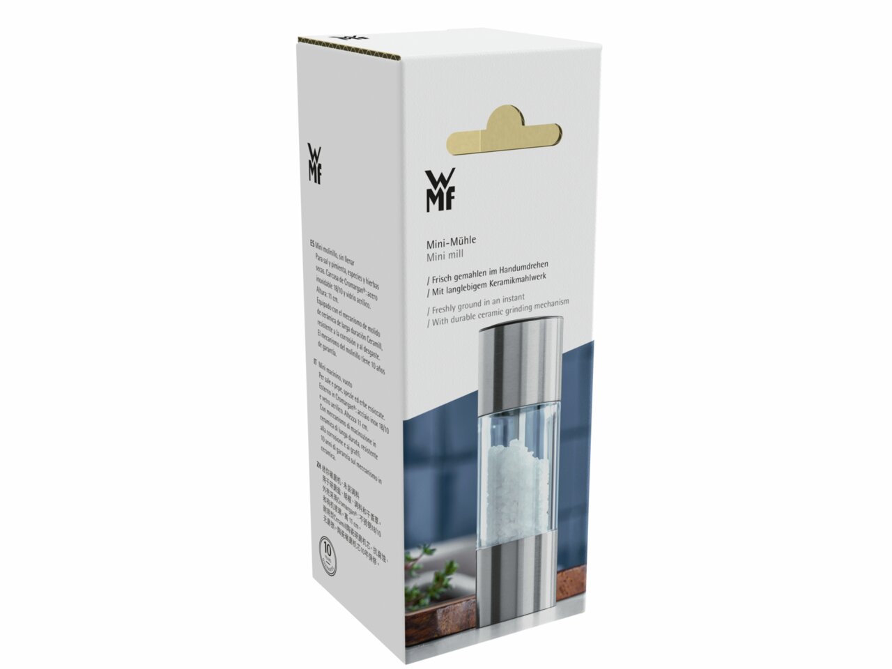 WMF Minimühle Verpackung der WMF Mini-Mühle aus schräger Perspektive, zeigt das Produktbild und die Beschreibungen in mehreren Sprachen.