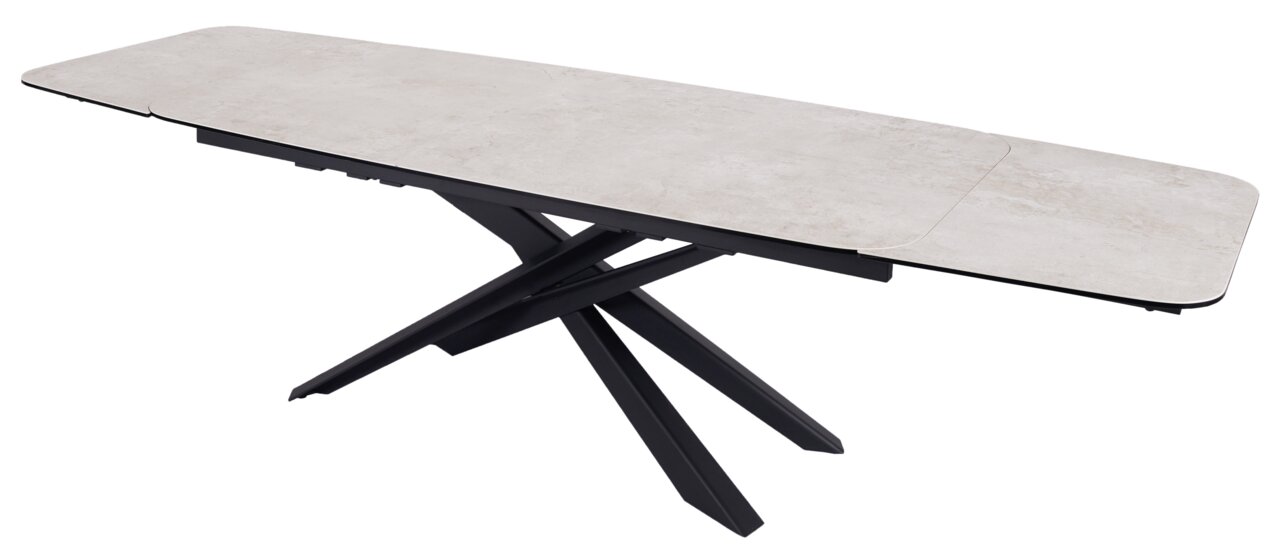 Moderne eettafel met een lichtgekleurd tafelblad en een zwart, kruisvormig onderstel, gezien vanaf de zijkant