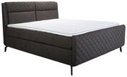 Boxspringbett in seitlicher Perspektive mit gestepptem Kopf- und Fußteil in dunklem Stoffbezug.