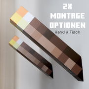Zwei pixelartige, längliche Wand- oder Tischleuchten in Braun- und Pastelltönen, schräg aus der Seitenperspektive an einer weißen Wand gezeigt, mit Text „2x Montage Optionen – Wand & Tisch“.