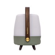 Frontansicht einer tragbaren Lampe mit Holzgriff, weißem oberen Teil und grünem unteren Teil, auf drei Beinen stehend.