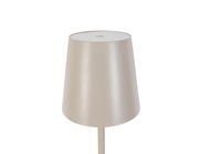 Nahaufnahme einer modernen, zylinderförmigen Akku-Stehleuchte in neutralem Farbton, von oben betrachtet.