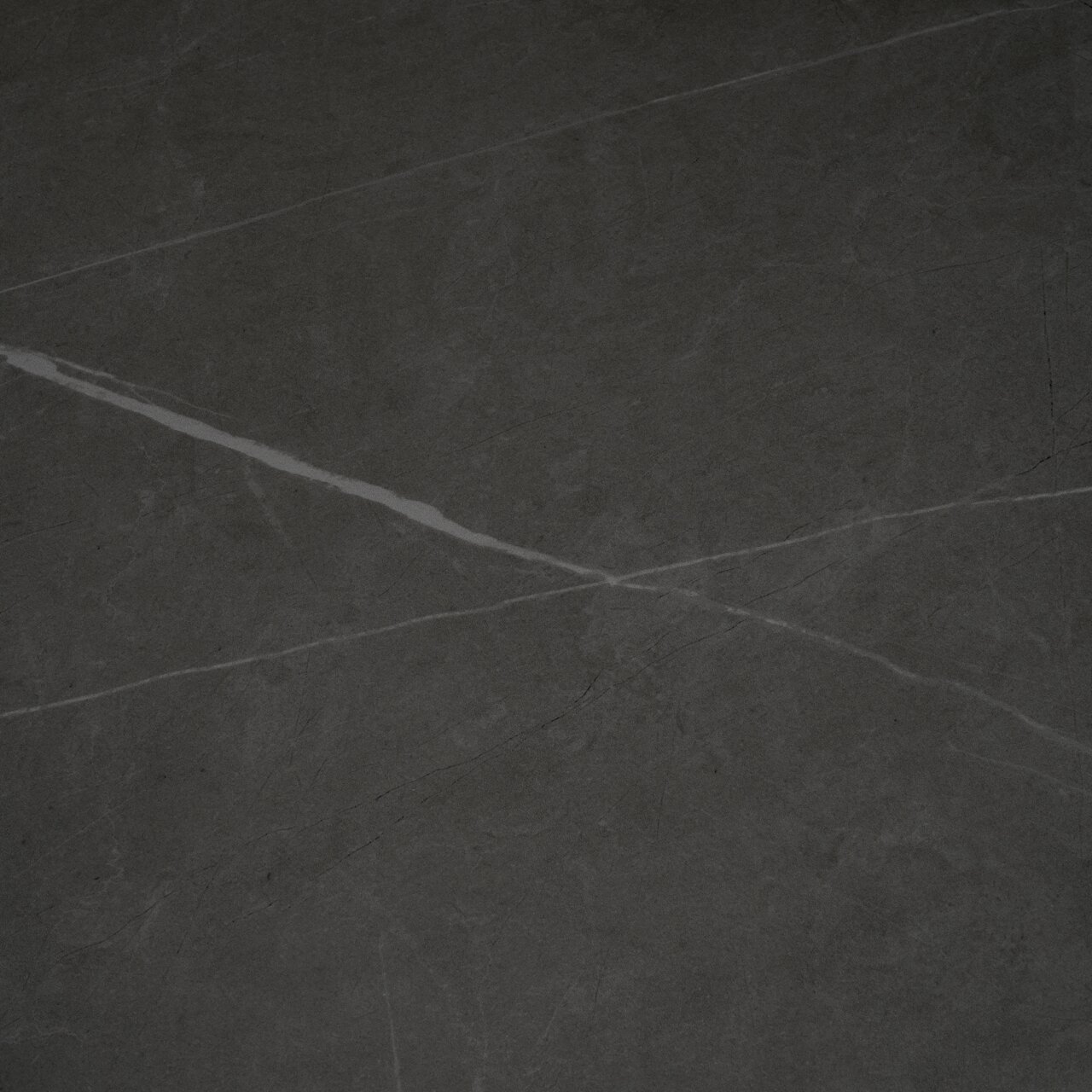 Z2 Funktions-Esstisch LINUS Draufsicht auf eine dunkle, marmorierte Tischplatte mit feinen, hellen Adern.