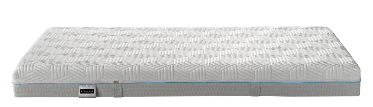 Seitliche Ansicht einer Gel-Kaltschaummatratze mit geometrischem Muster und blauer Ziernaht.