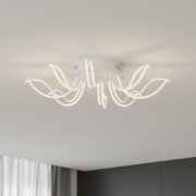 Moderne witte led-plafondlamp met gebogen, lusvormige lichtarmen, van onderaf lichtjes zijdelings tegen het plafond gefotografeerd