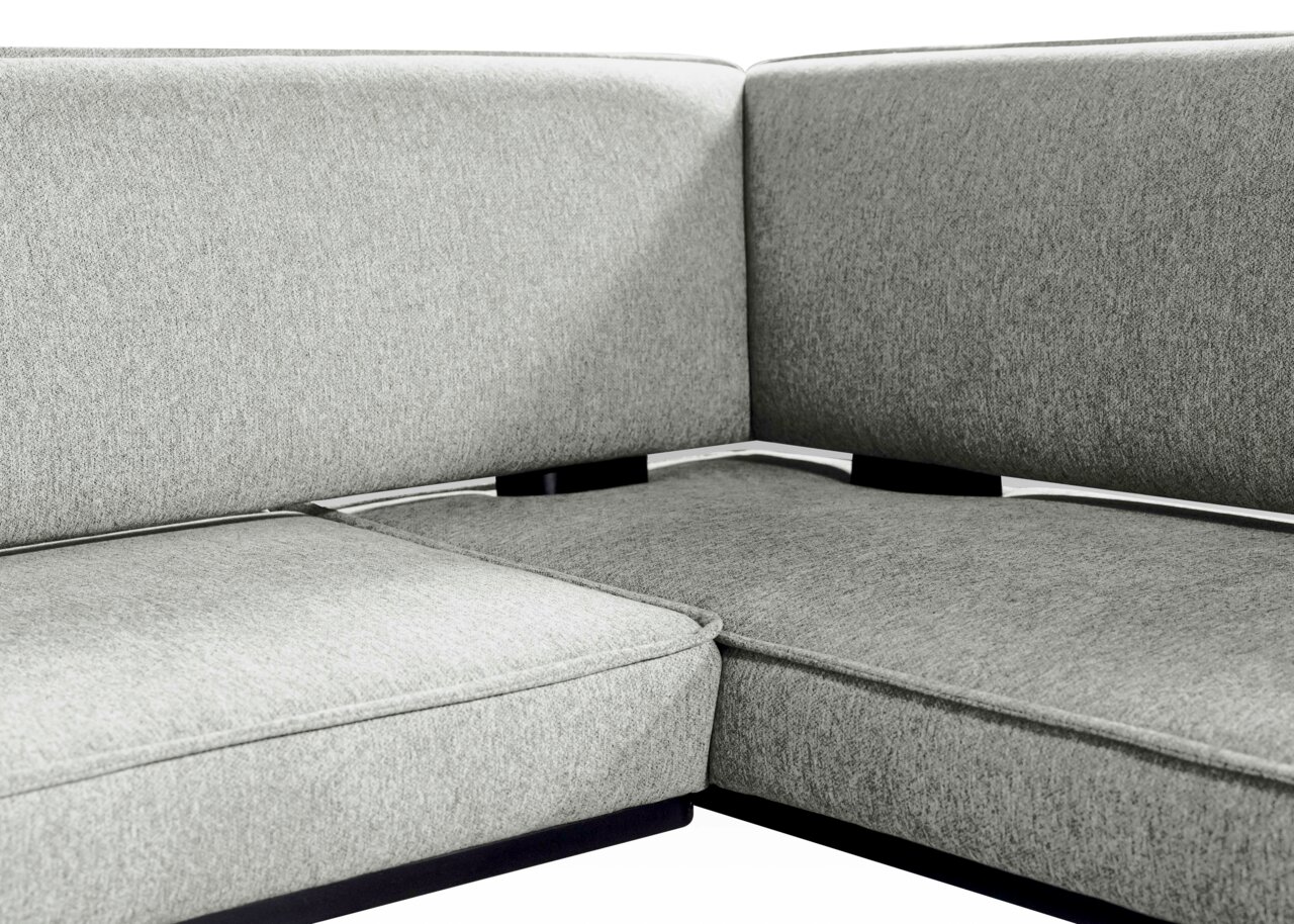 Z2 Eckbank VOLOS Nahaufnahme einer grauen Eckbank mit gepolsterten Sitz- und Rückenflächen, Perspektive von oben.