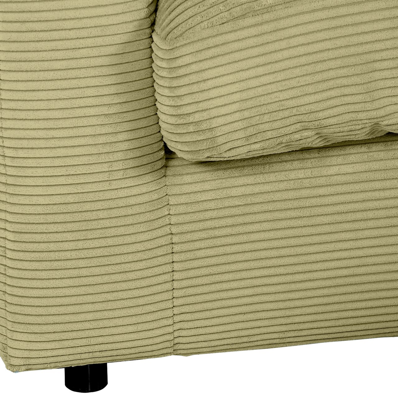 Close-up van een groene ronde hoekbank met geribbelde stoffen bekleding, gezien vanaf de zijkant