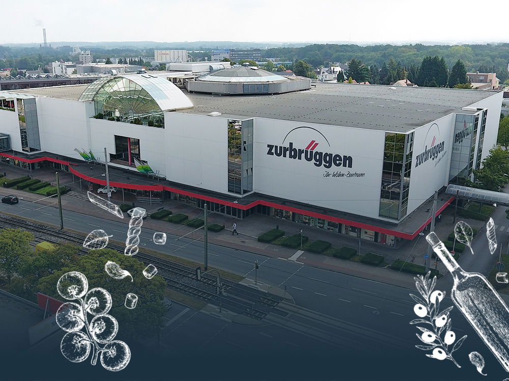 Wohn-Zentrum in Bielefeld mit gezeichneten Food-Icons wie Gemüse, Pasta und Flasche.