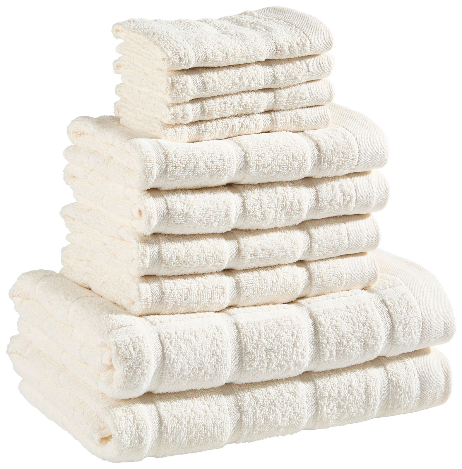 Ein Stapel aus weißen Frottierhandtüchern in verschiedenen Größen, von der Seite betrachtet.