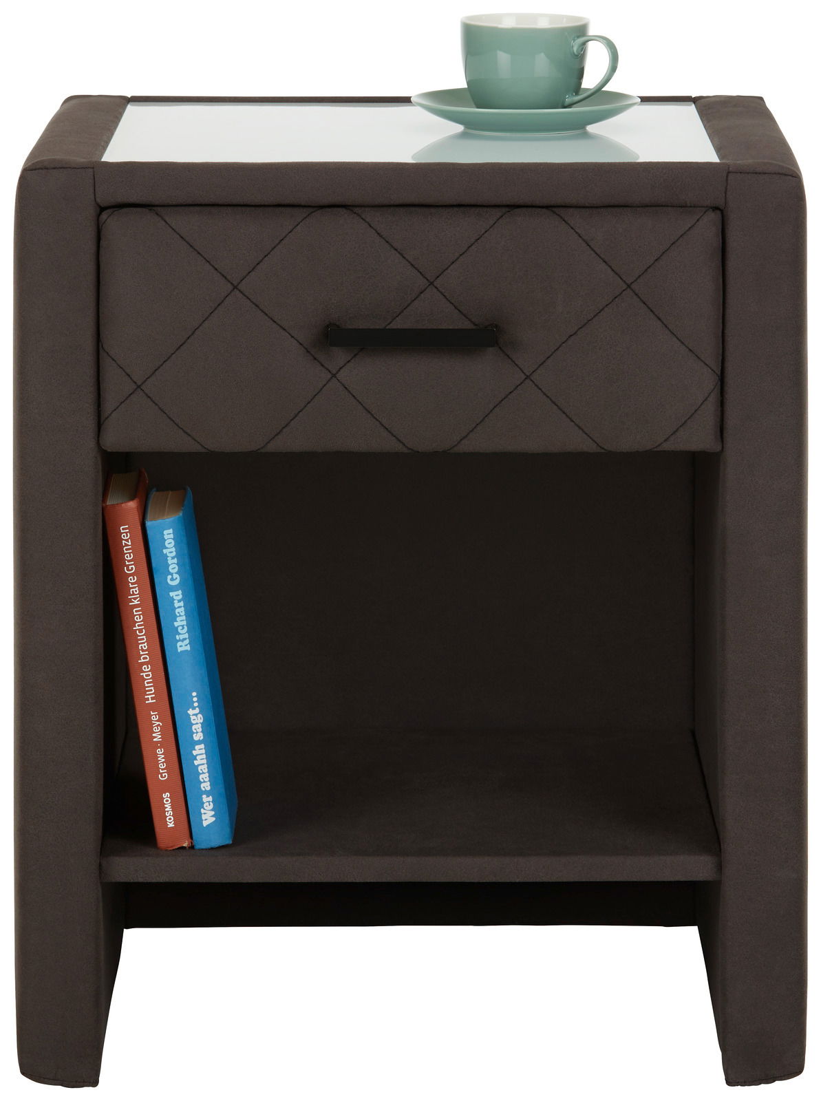 Nachtkommode in dunklem Stoff mit einer Schublade und einem offenen Fach, darauf eine Tasse. Frontalansicht.