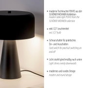 Moderne schwarze Tischleuchte PENTO mit rundem Schirm und konischem Fuß, eingeschaltet, seitliche Nahaufnahme aus leicht schräger Vorderansicht auf hellem Untergrund