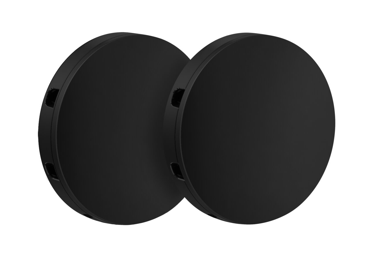 Zwei runde, schwarze Edelstahlplatten in seitlicher Perspektive.