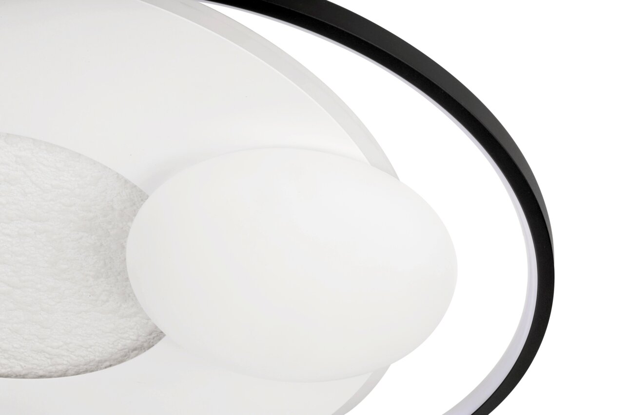 Close-up van een moderne led-plafondlamp met een cirkelvormig ontwerp en contrasterende zwarte en witte elementen.
