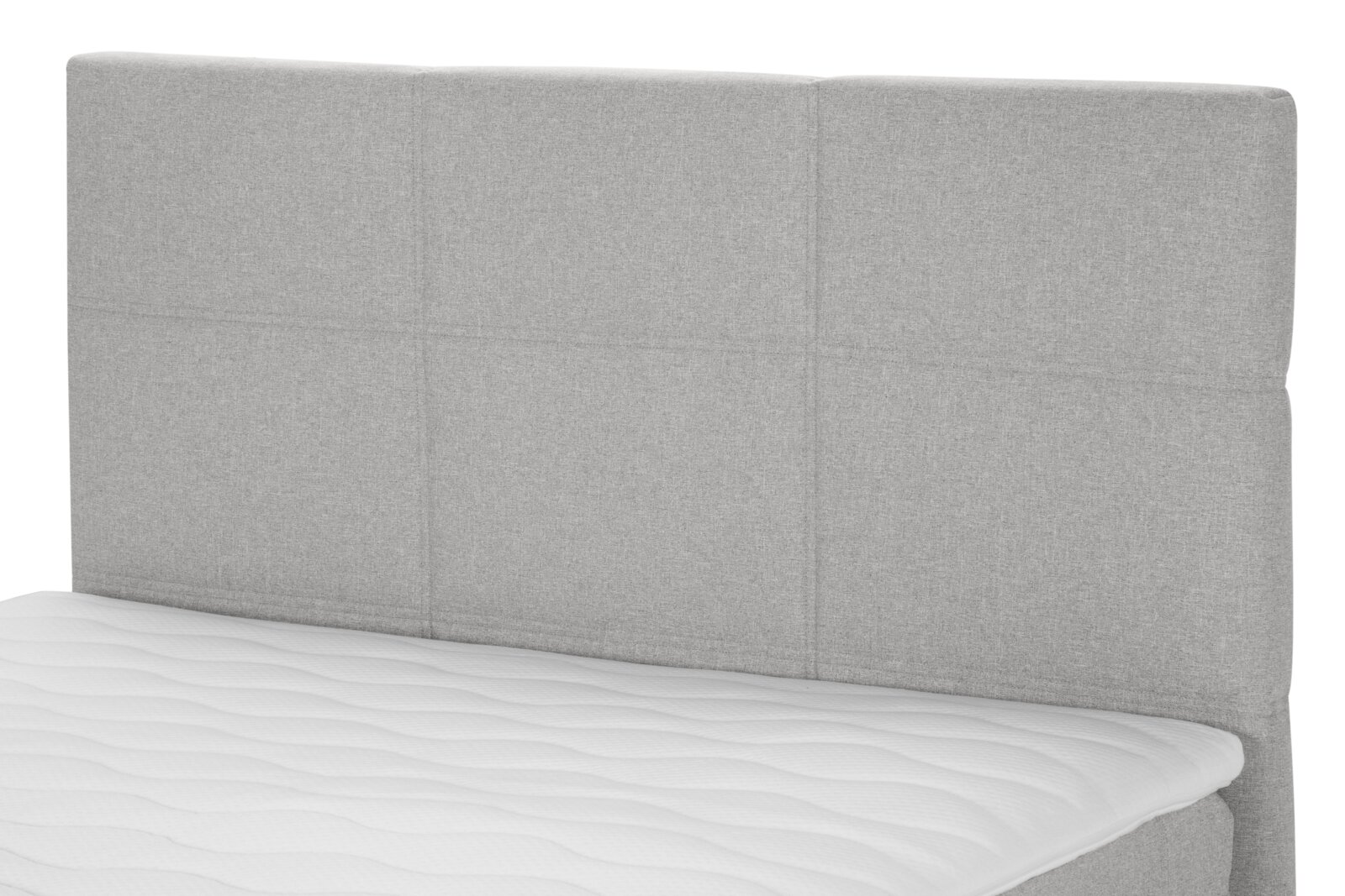 Graues Boxspringbett mit gepolstertem Kopfteil, seitliche Perspektive