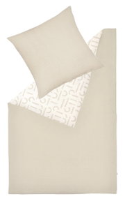 Beddengoedset in beige met kussensloop en dekbedovertrek, gefotografeerd van bovenaf