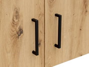 Nahaufnahme eines Holz-Aufsatzschranks mit zwei schwarzen Griffen, seitliche Perspektive
