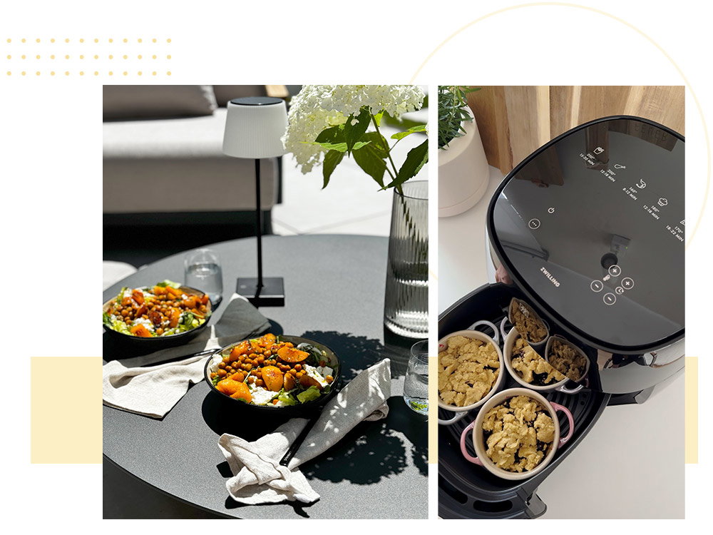Een moderne eetkamer met twee borden vol eten en een heteluchtfriteuse op de achtergrond.