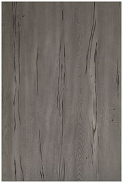 Draufsicht auf eine graue Tischplatte mit Holzmaserung.