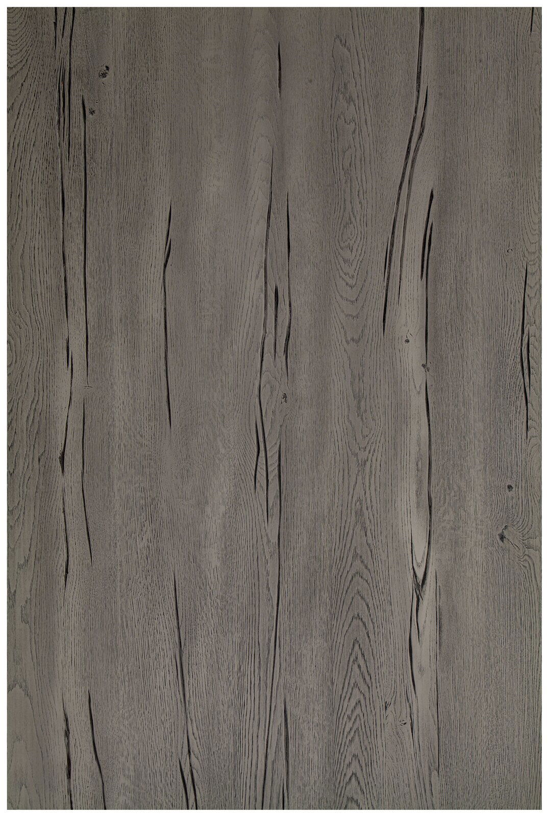 Draufsicht auf eine graue Tischplatte mit Holzmaserung.