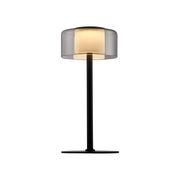 Moderne Tischleuchte RIKA mit schwarzem Standfuß und transparentem Lampenschirm, seitliche Perspektive