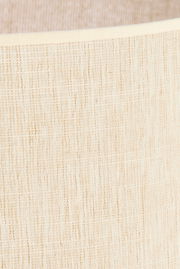 Nahaufnahme eines beigen Lampenschirms mit texturierter Oberfläche