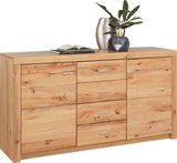 Holz-Sideboard mit drei Schubladen und zwei Türen, dekoriert mit einer Pflanze und einem Buch, aus frontaler Perspektive.
