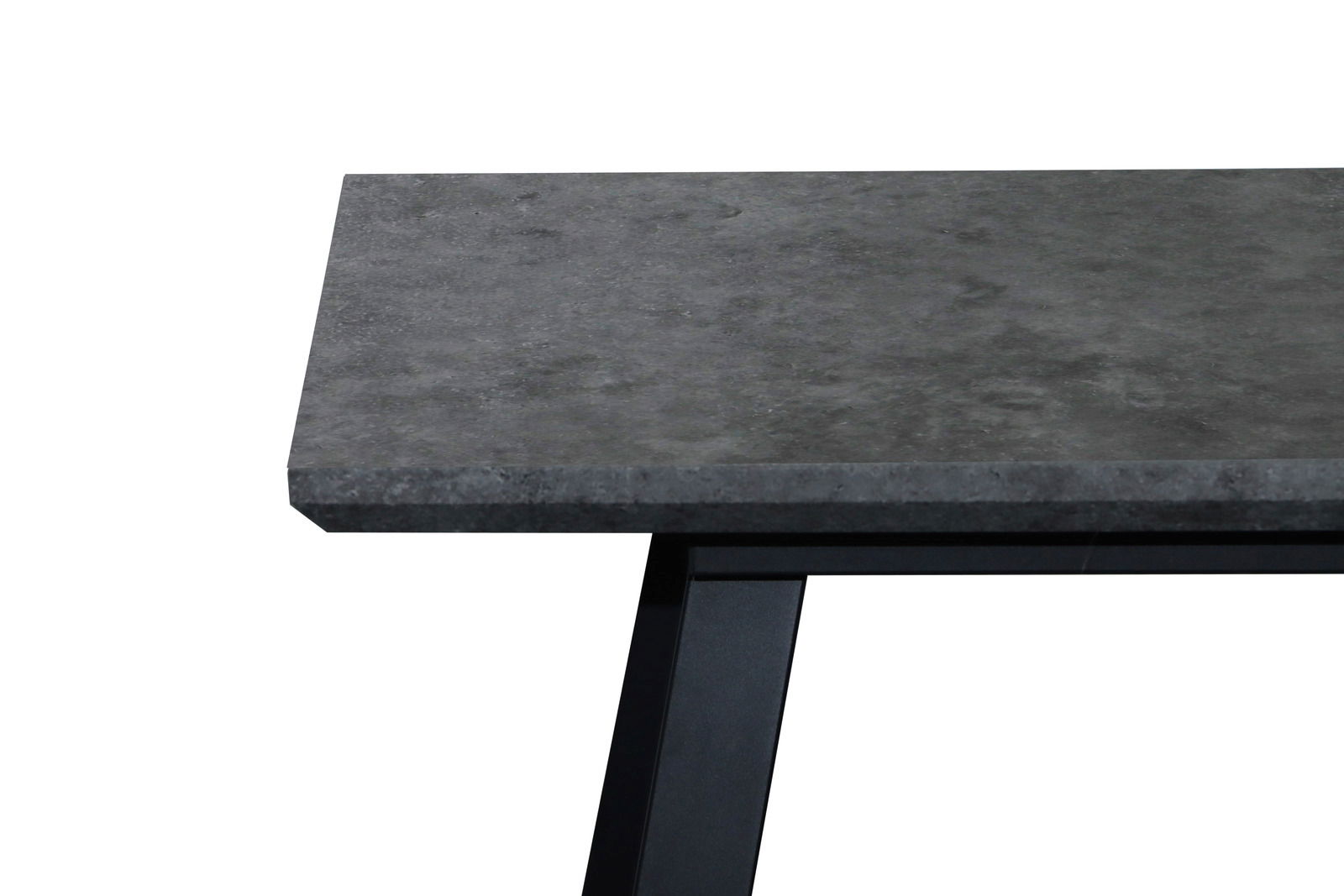 Z2 Funktions-Esstisch WOLF Nahaufnahme eines Esstisches mit dunkler Steinplatte und schwarzem Metallgestell, seitliche Perspektive