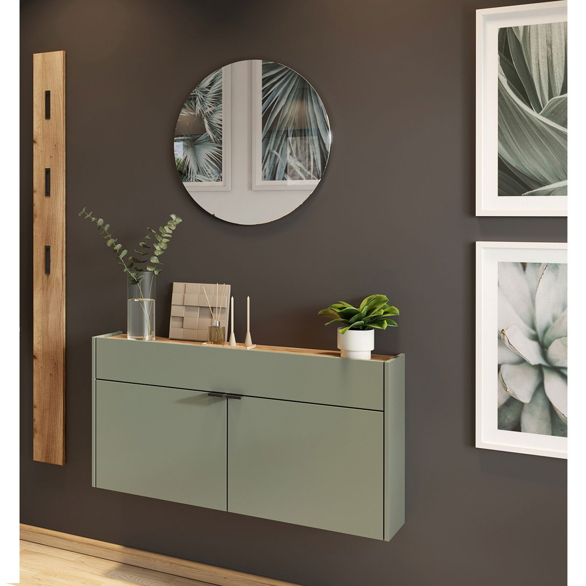 Moderne Garderobe mit grünem Schrank, rundem Spiegel und Dekorationen, seitliche Perspektive
