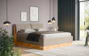 Modernes Polsterbett in einem stilvollen Schlafzimmer, seitliche Perspektive