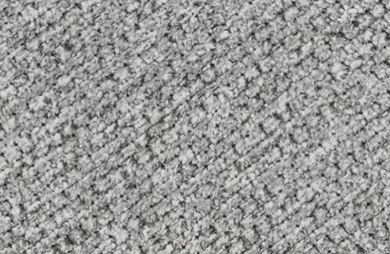 Nahaufnahme eines grauen, strukturierten Stoffes in diagonaler Perspektive.