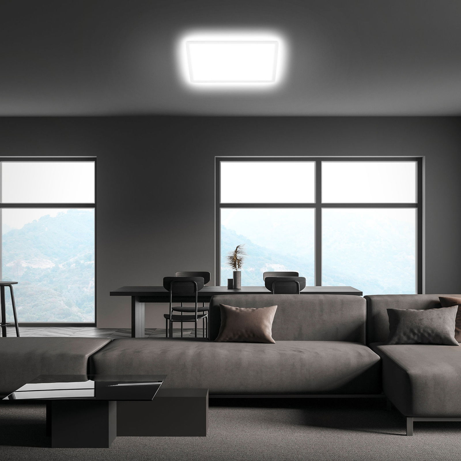 Moderne LED-Deckenleuchte in einem stilvollen Wohnzimmer, von unten betrachtet.